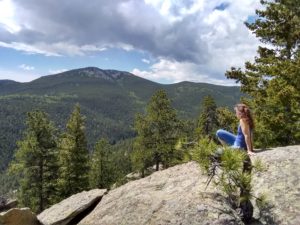 Jo looking out from outcrop