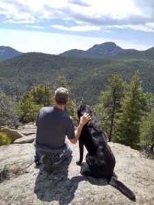 Man & Dog looking out into the hills